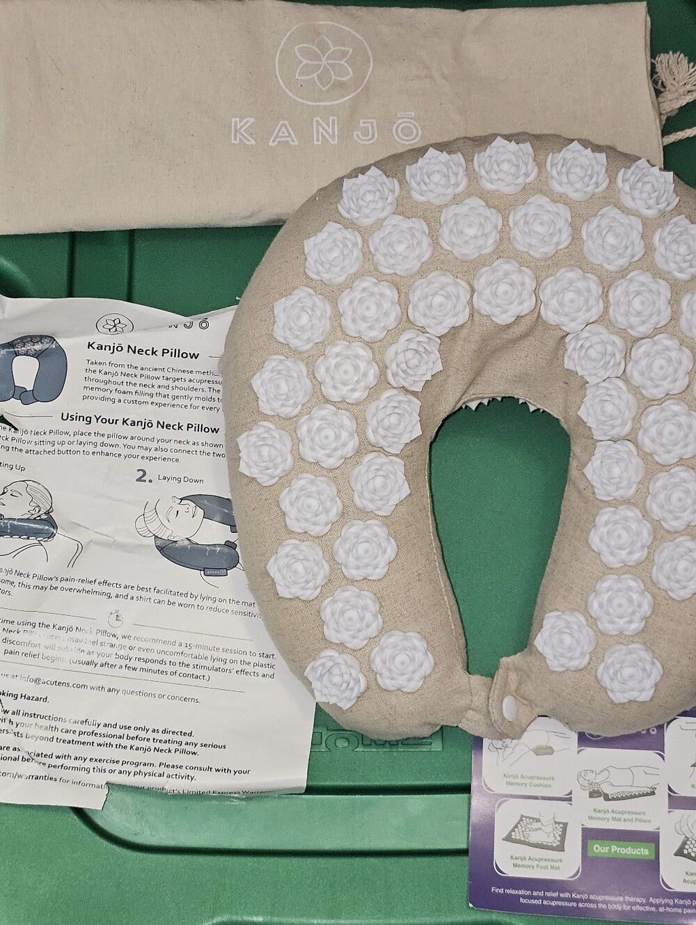 beige Kanjo memory foam acupressure neck pillow white floral-shaped stimulation